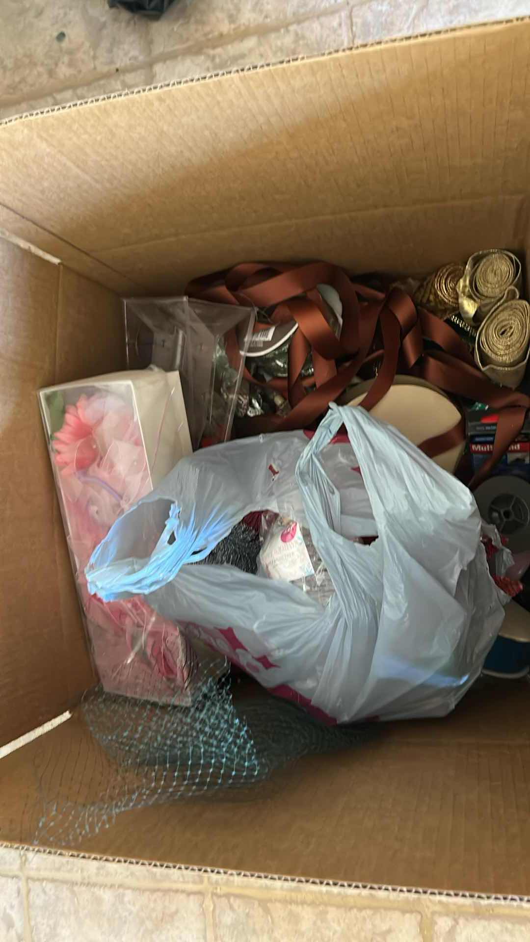Photo 1 of CONTENTS OF BOX-RIBBON AND CORD.
