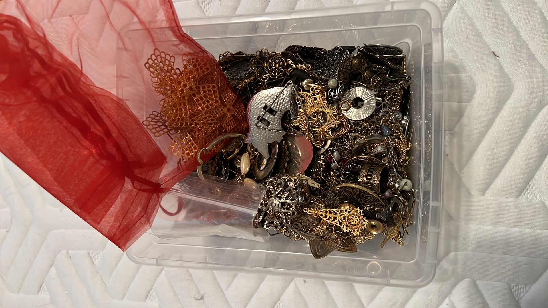 Photo 1 of PLASTIC BOX OF METAL JEWELRY MAKING EMBELLISHMENTS AND FINDINGS