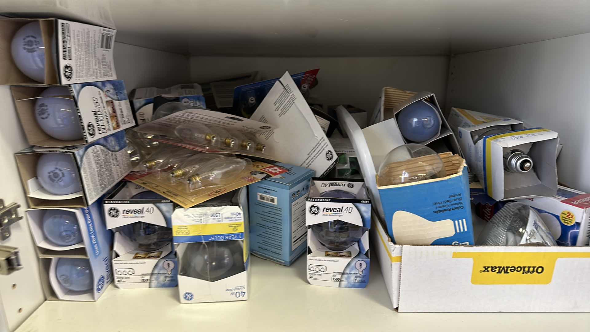 Photo 1 of CONTENTS OF CABINET,LIGHT BULBS DIFFERENT SIZES AND PAPER GOODS