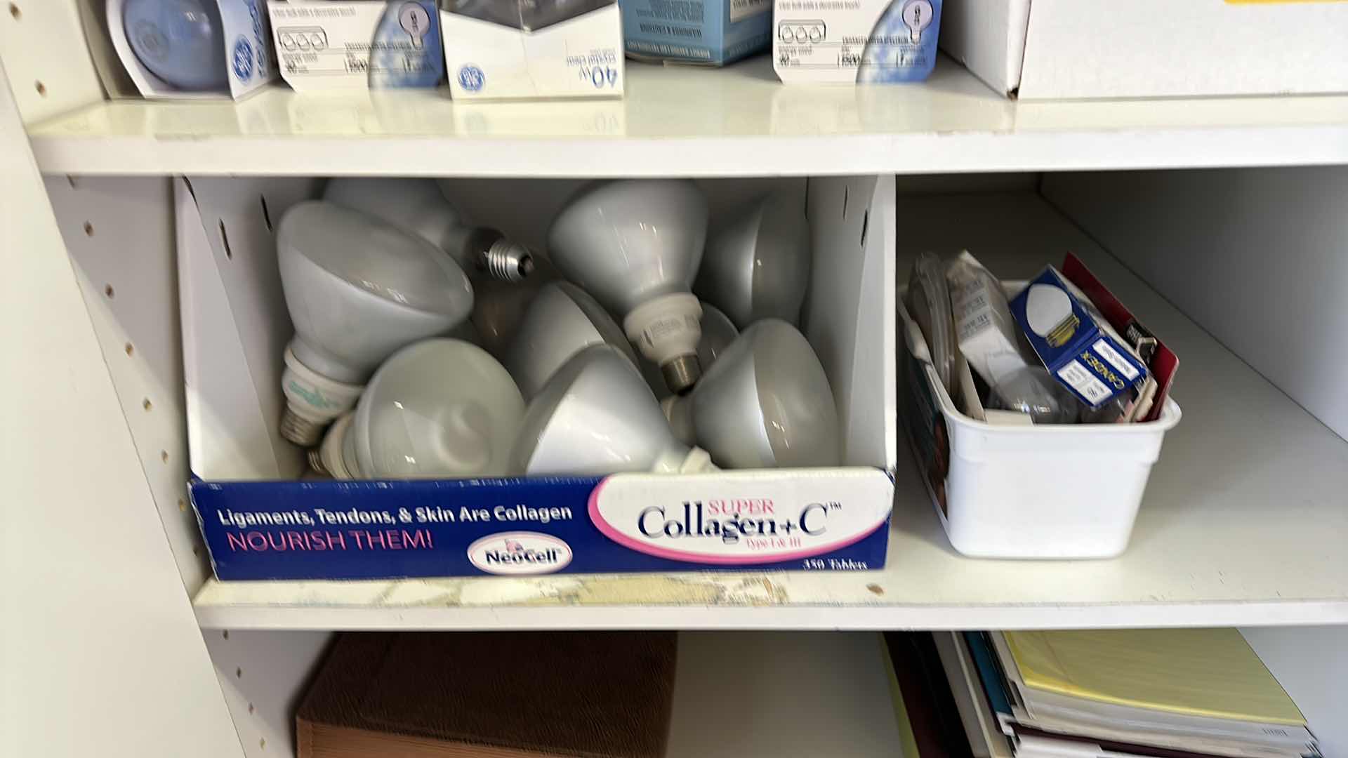 Photo 1 of CONTENTS OF CABINET,LIGHT BULBS DIFFERENT SIZES AND PAPER GOODS