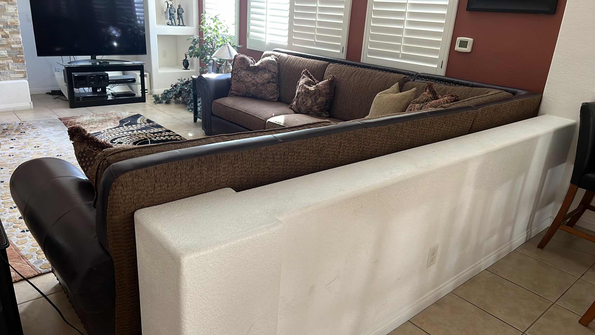 Photo 1 of BROWN LEATHER W UPHOLSTERED CUSHIONS 3 PC SECTIONAL  124" x 124"