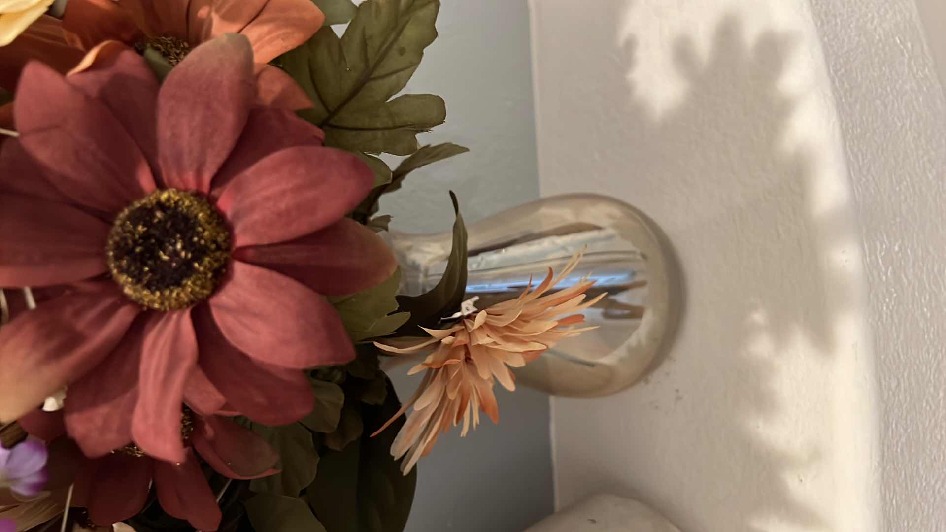 Photo 1 of FAUX FLORAL FALL ARRANGEMENT IN AMBER GLASS VASE H36", CERAMIC POTTERY JUG W ORANGE DESIGN H9"