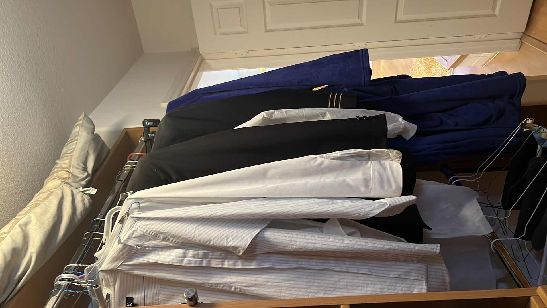 Photo 1 of CONTENTS OF PRIMARY CLOSET MEN'S CLOTHES (AVERAGE SIZE SHIRTS XL, PANTS 36)