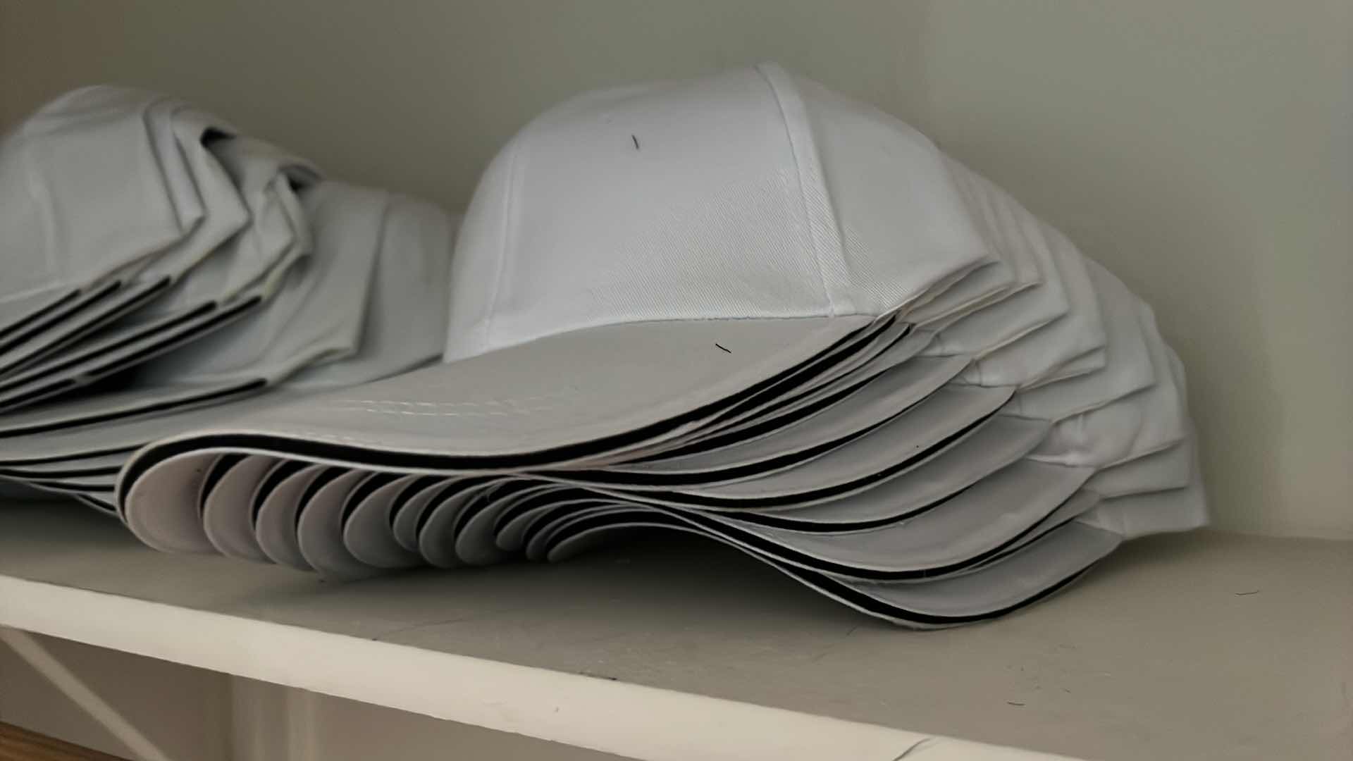 Photo 1 of BRAND NEW WHITE BASEBALL CAPS