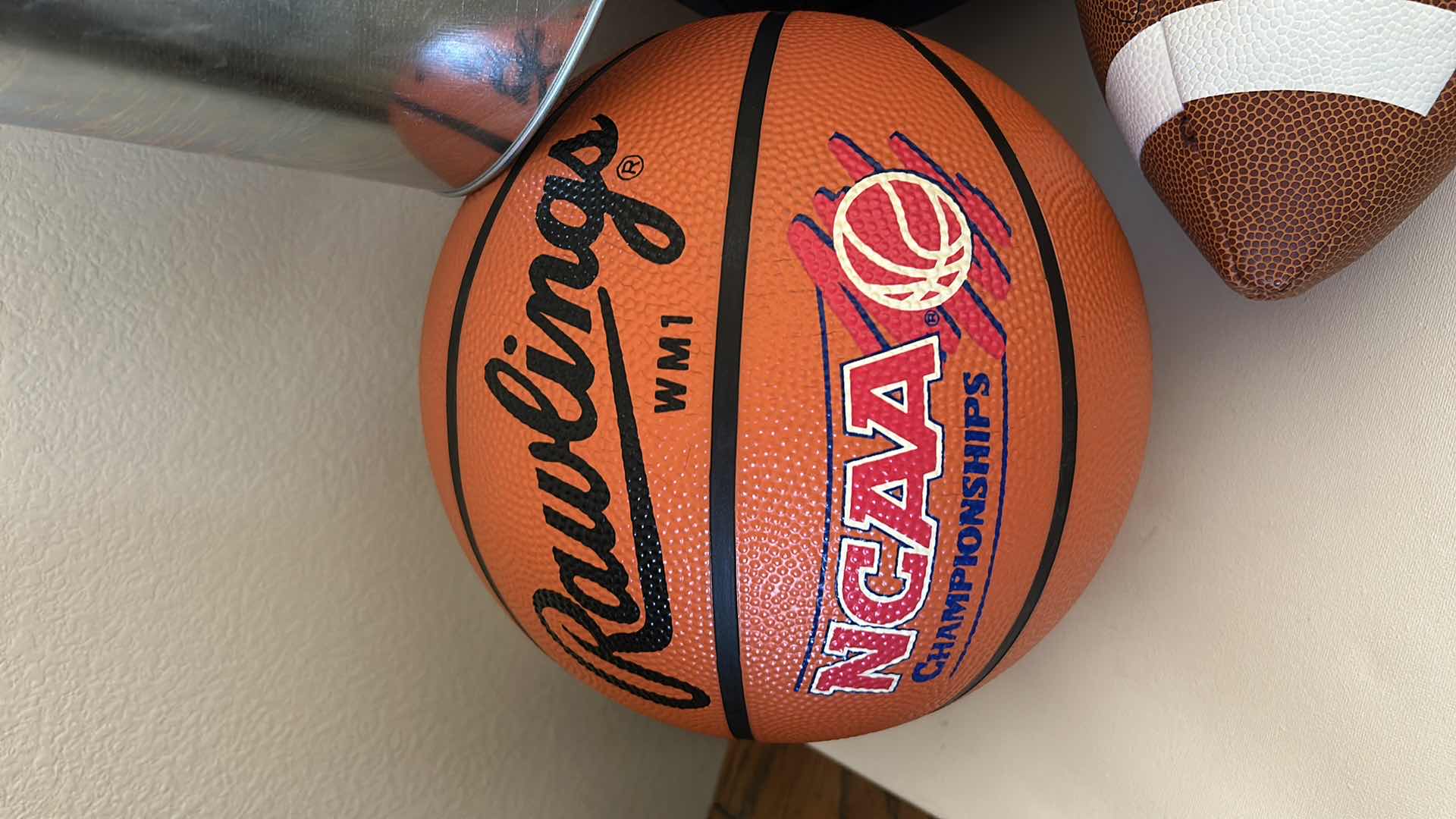 Photo 1 of 2 BASKETBALLS, FOOTBALL AND RAIDERS BUCKET