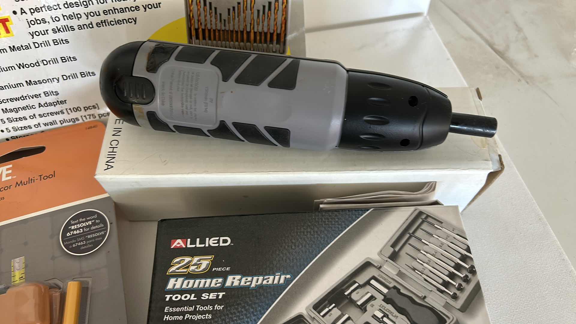 Photo 1 of 4 NEW GARAGE ITEMS - 2 DRILLS, MULTI TOOL AND HOME REPAIR TOOL SET