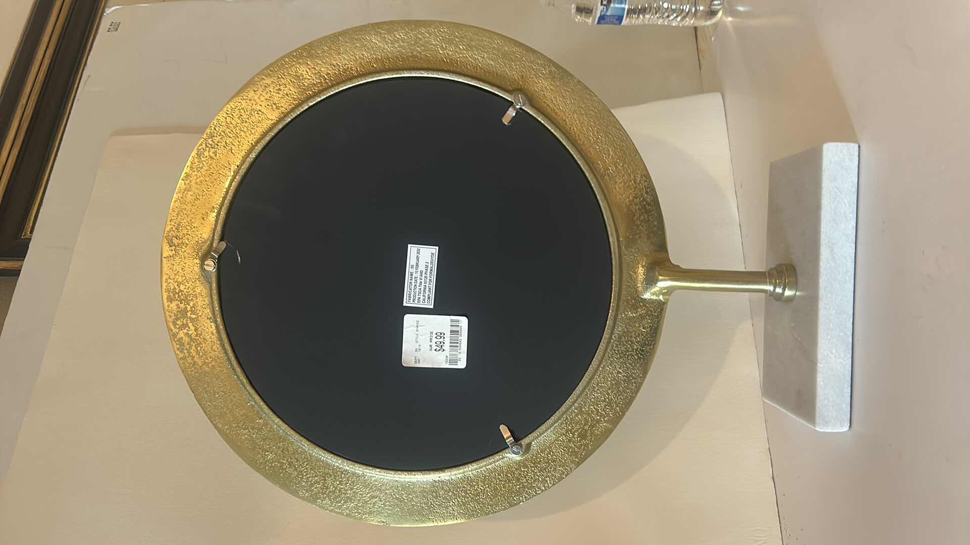 Photo 1 of HAMMERED BRASS FRAMED MIRROR ON MARBLE BASE $50 H20.5”