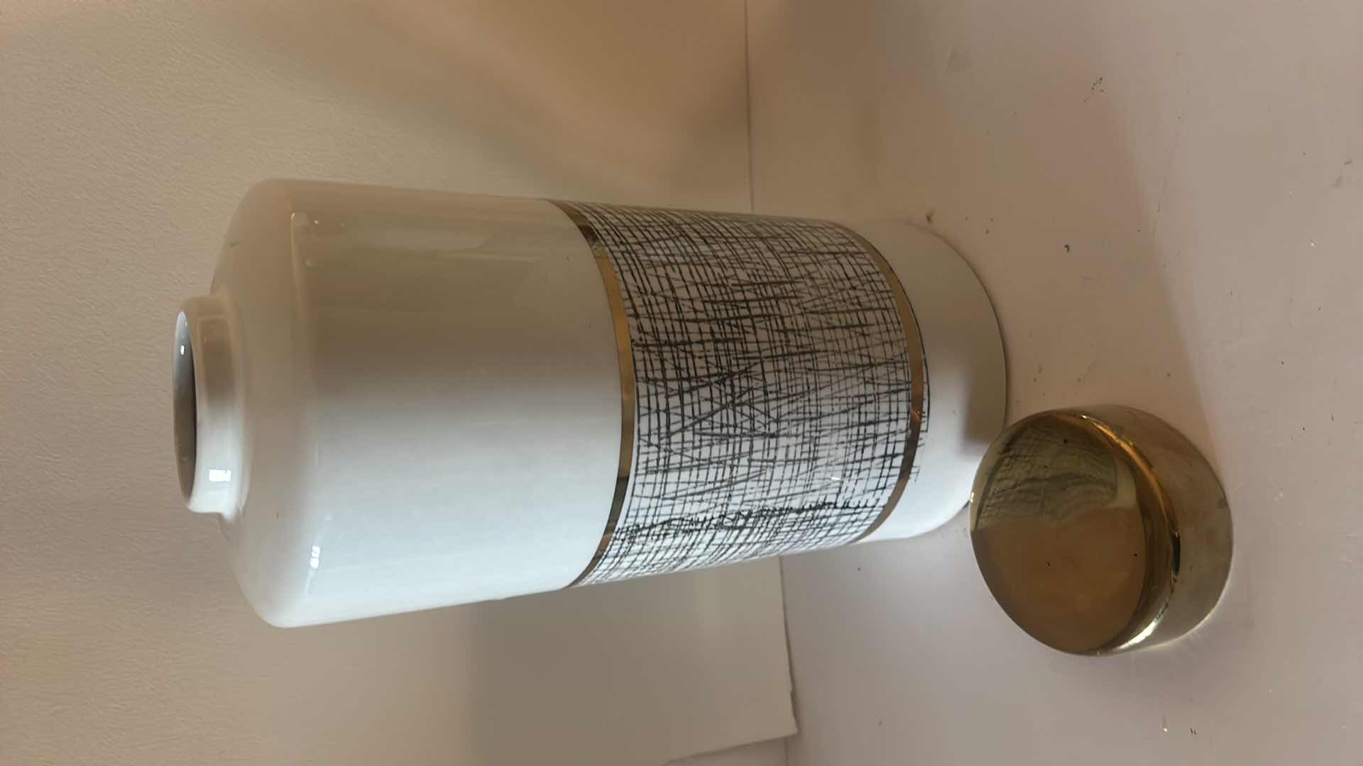 Photo 1 of HOME DECOR- 2 BLACK, WHITE & GOLD LIDDED JARS (TALLEST H 13”