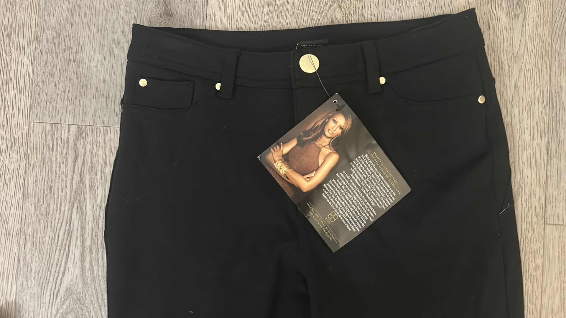 Photo 1 of 7 - WOMENS CLOTHING- 3 PAIRS IF PANTS AND 4 TOPS (MOSTLY MEDIUM)