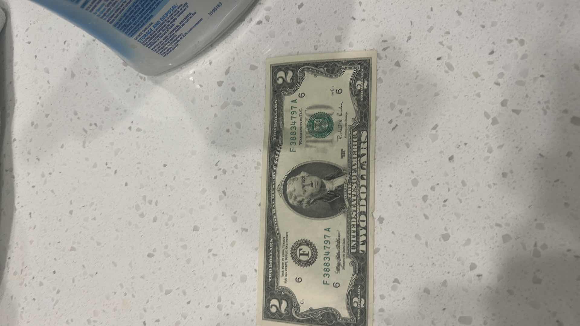 Photo 1 of US CURRENCY- 9 $2 BILLS, 3 KENNEDY HALF DOLLARS, GEORGE WASHINGTON $1 GOLD COIN & WAMPAMGAG TREATY GOLD $1 COIN