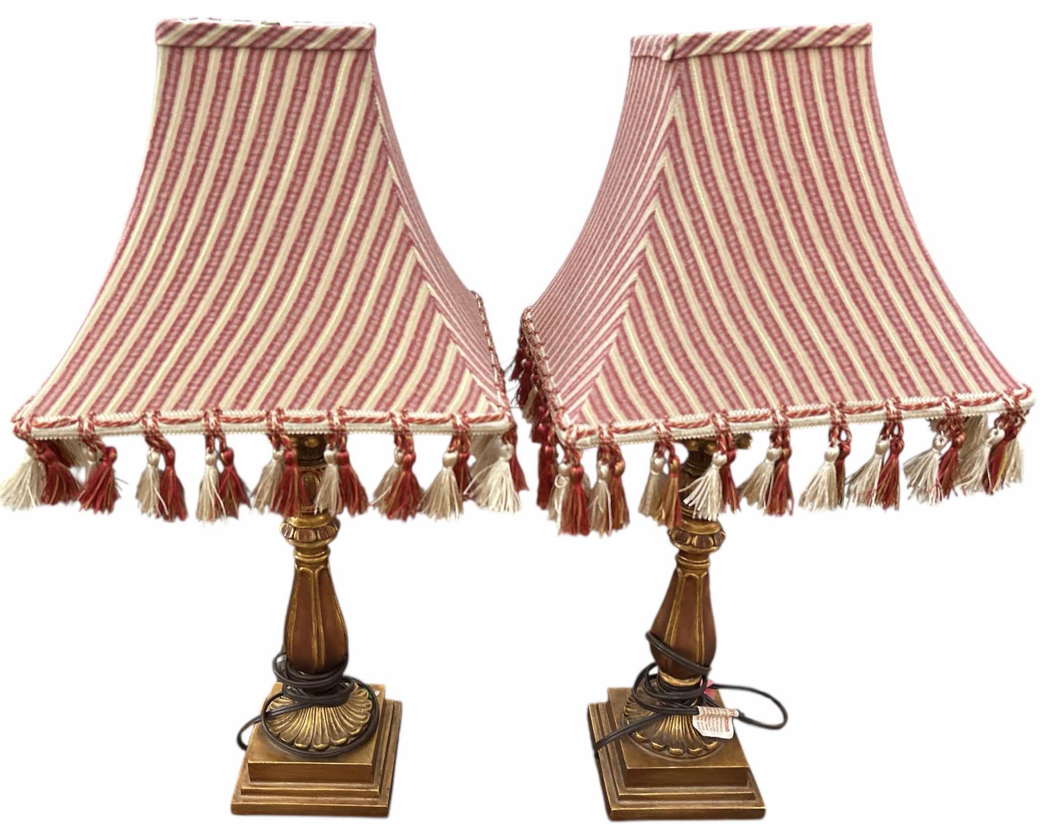 Photo 1 of 2 ANTIQUE GOLD COLORED TABLE LAMPS WITH RED AND IVORY FABRIC SHADES WITH TASSELS H26”