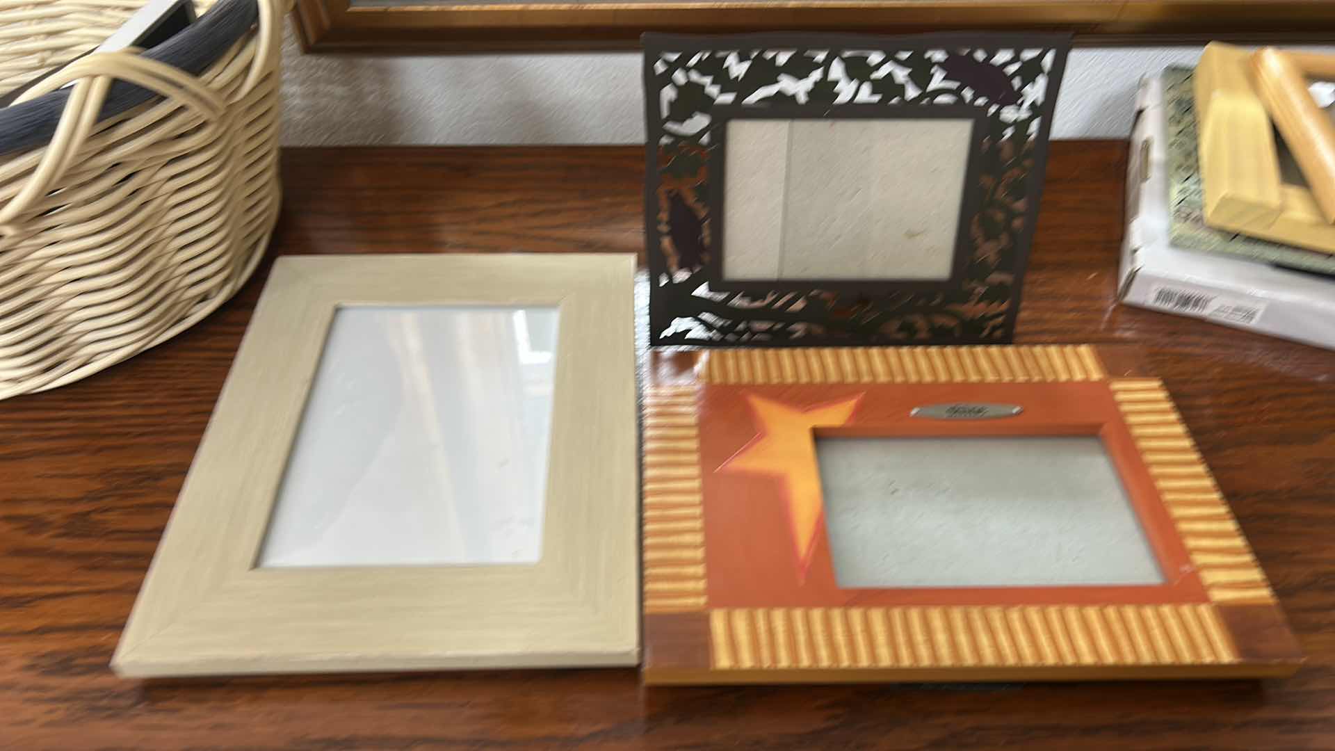 Photo 1 of BASKET FULL OF PICTURE FRAMES