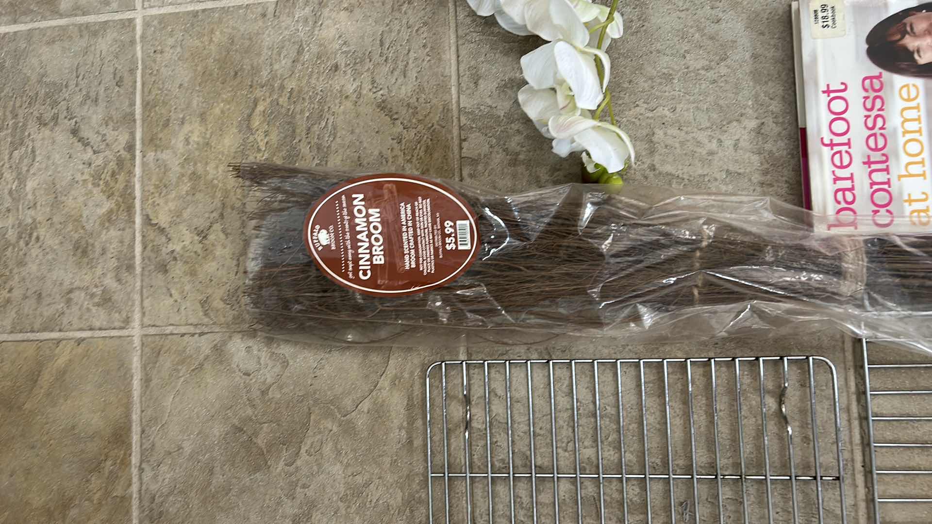 Photo 1 of HOUSEHOLD ASSORTMENT- WIRE RACKS, CINNAMON BROOM, HARDCOVER BOOK, FAUX ORCHID IN GLASS VASE