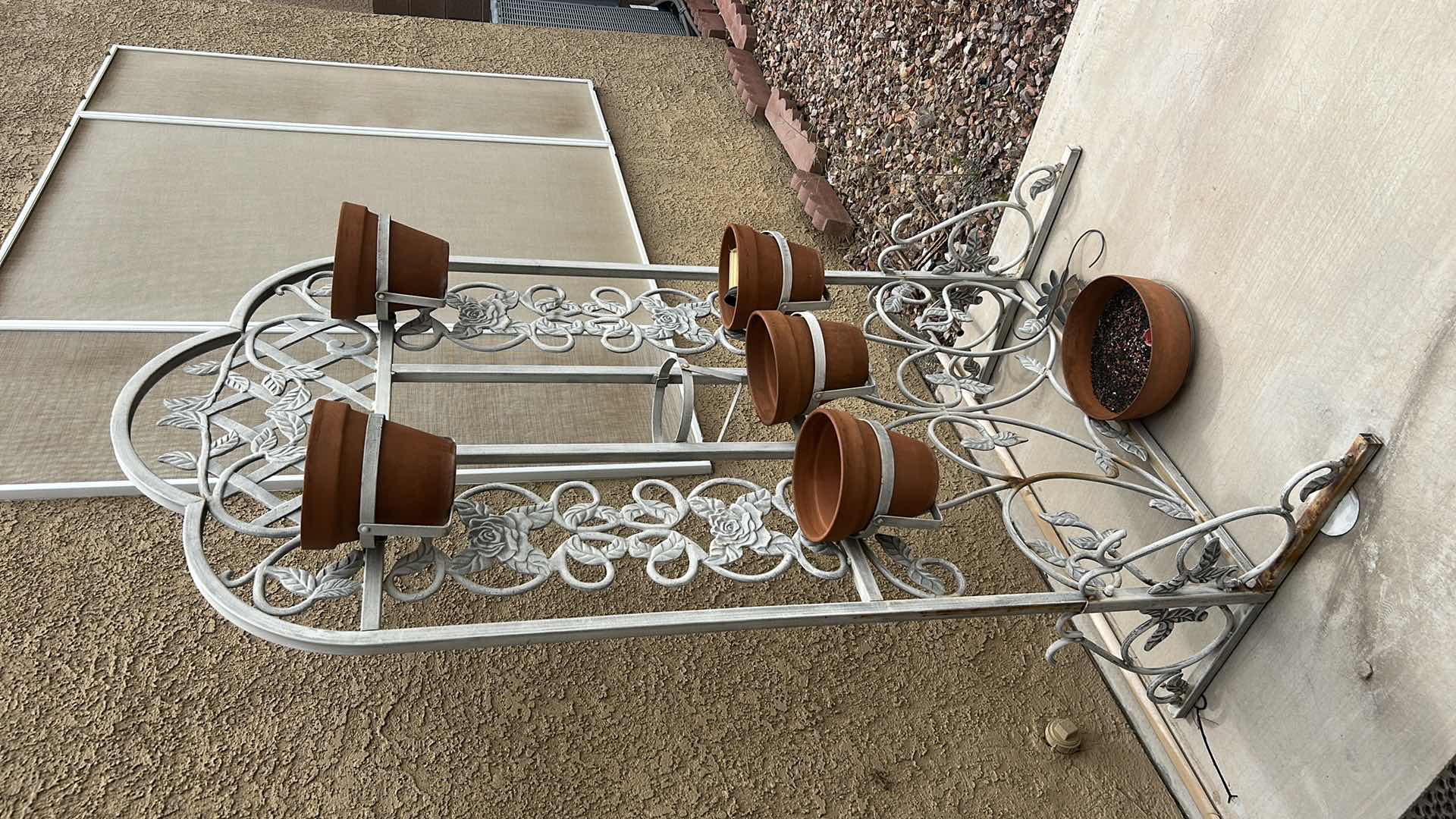 Photo 1 of HEAVY METAL PLANT STAND WITH POTS 40” x H6’