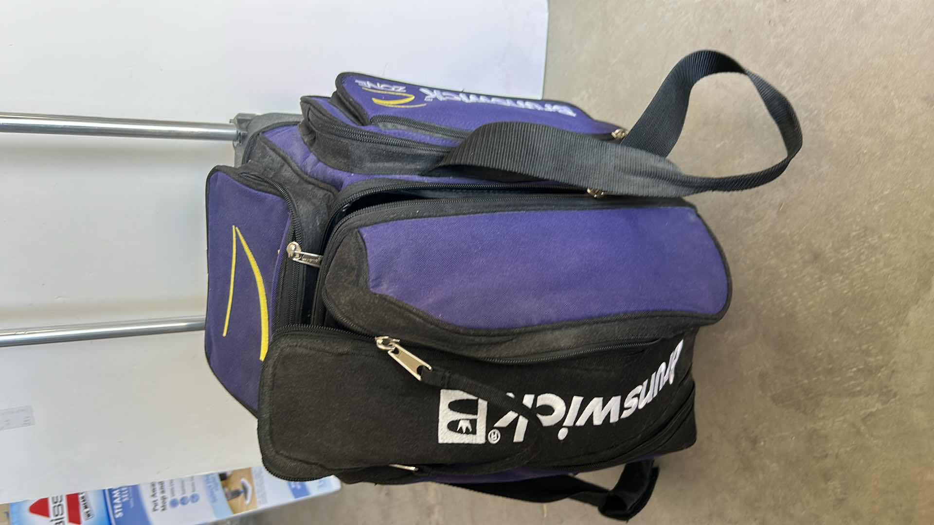 Photo 2 of BRUNSWICK ROLLING BOWLING CASE AND BOWLING BALL