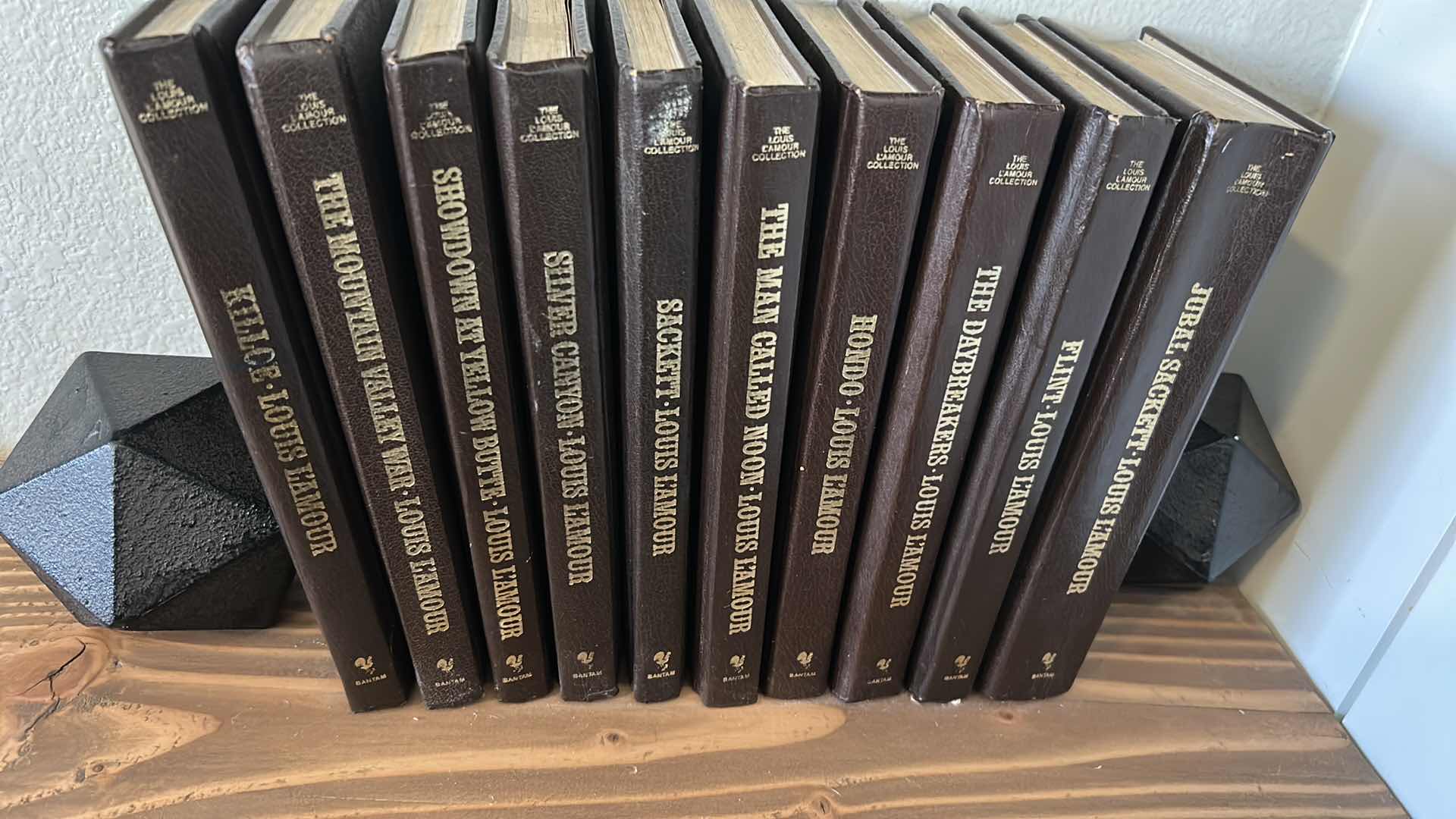 Photo 1 of COLLECTION OF LOUIS L’ AMOUR BOOKS W BLACK BOOKENDS