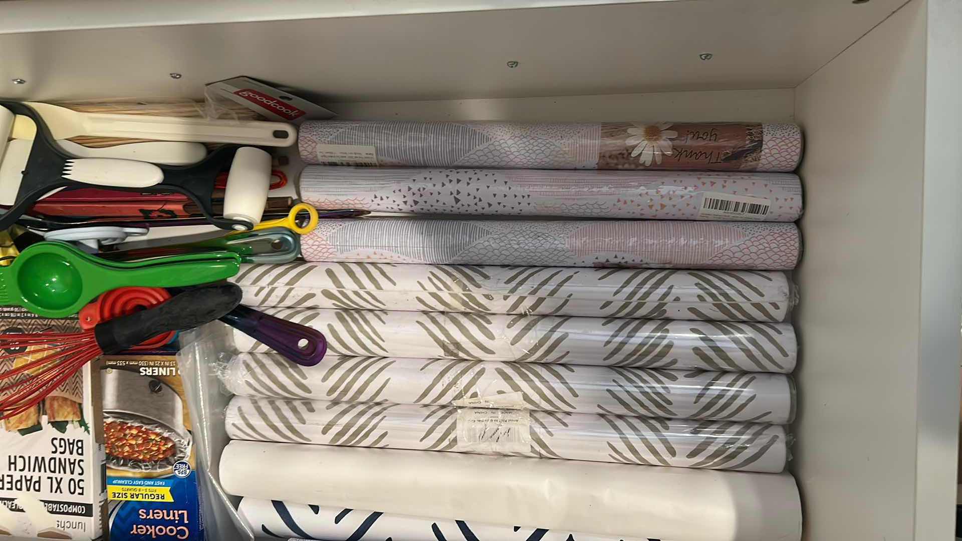 Photo 1 of CONTENTS OF DRAWER ASSORTED SHELF PAPER COOKING UTENSILS
