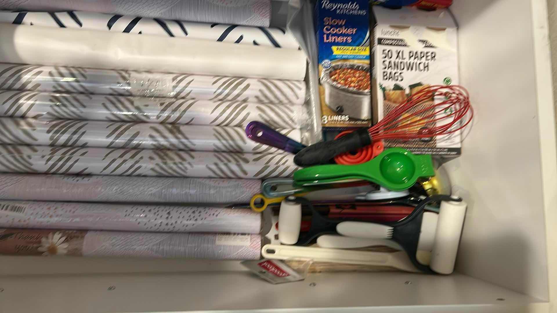 Photo 1 of CONTENTS OF DRAWER ASSORTED SHELF PAPER COOKING UTENSILS