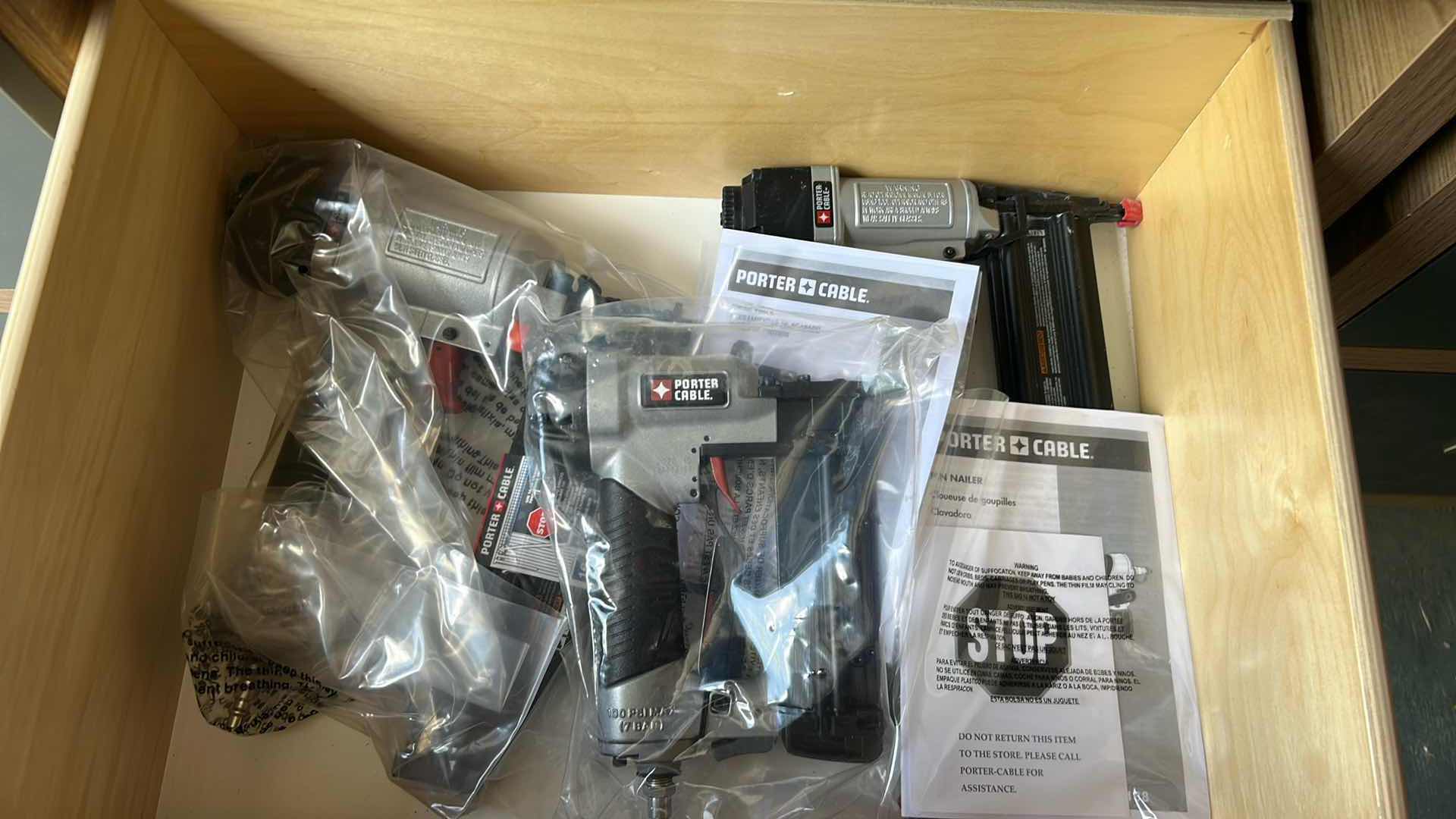Photo 1 of CONTENTS OF DRAWER 3- PORTER CABLE GUAGE BRAD NAILER