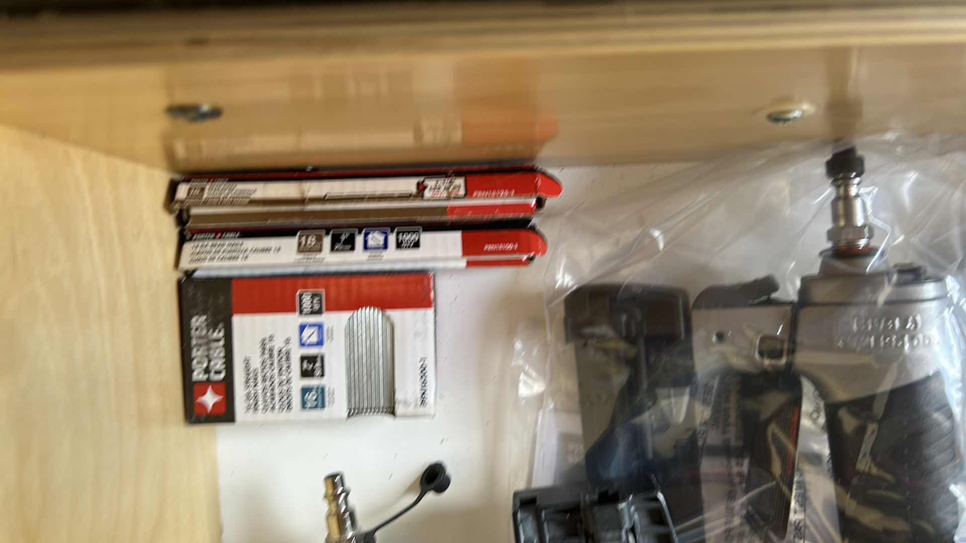 Photo 1 of CONTENTS OF DRAWER 3- PORTER CABLE GUAGE BRAD NAILER