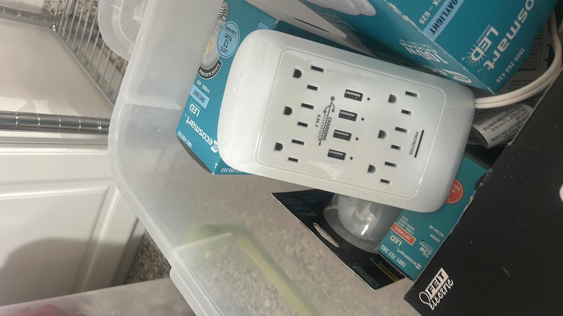 Photo 1 of TOTE WITH LIGHT BULBS AND HOME IMPROVEMENT ITEMS