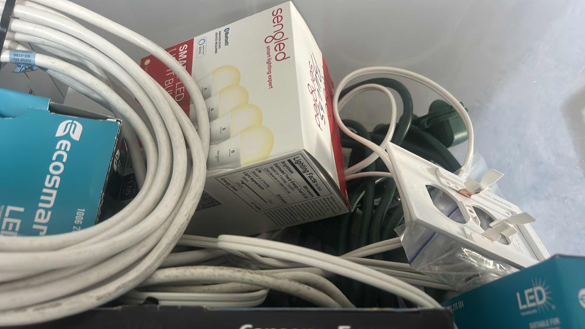 Photo 1 of TOTE WITH LIGHT BULBS AND HOME IMPROVEMENT ITEMS