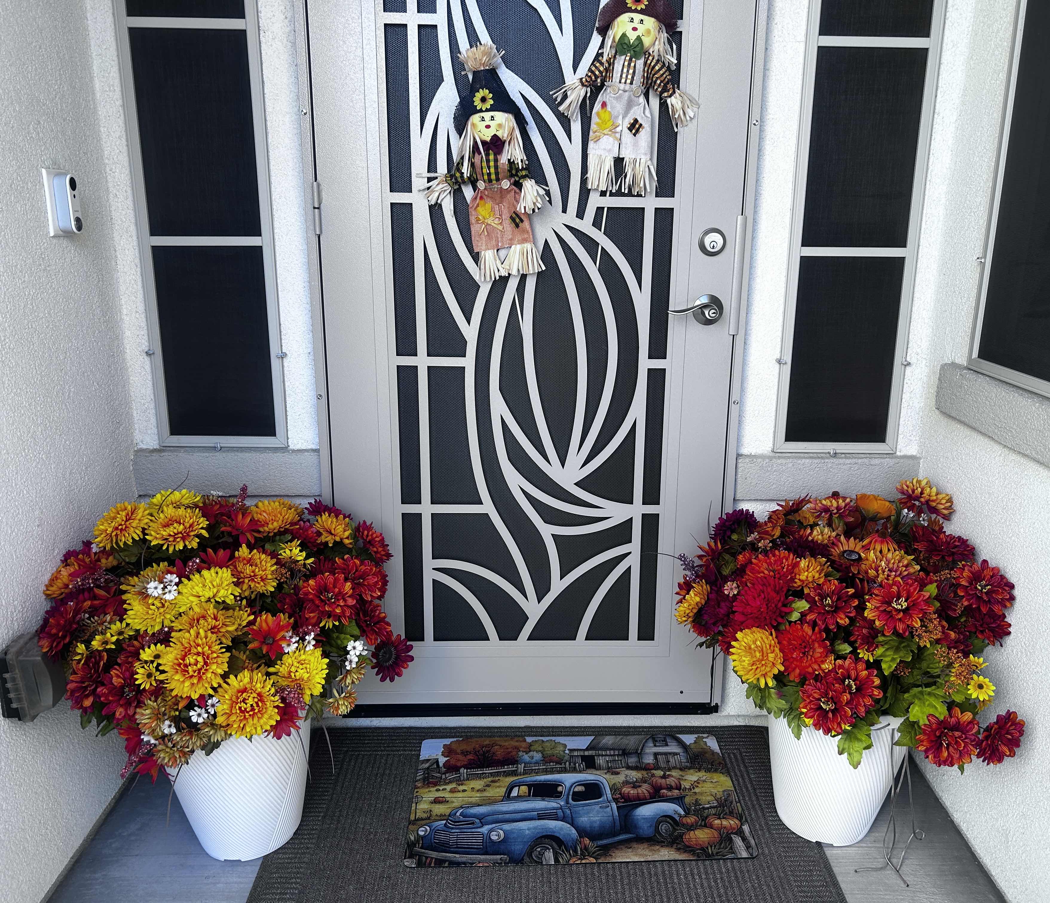 Photo 1 of 2 OUTDOOR FAUX FALL FLORAL ARRANGEMENTS H27” (POTS ARE HARD PLASTIC) AND  2 SCARECROWS H17”
