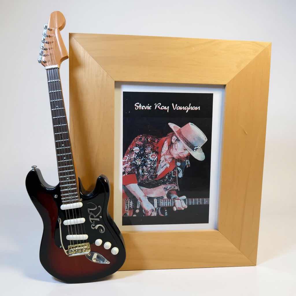 Photo 1 of FRAMED STEVIE RAY VAUGHN WITH MINIATURE COLLECTABLE GUITAR H9”