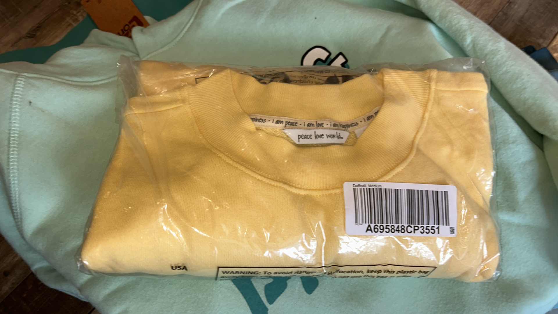 Photo 1 of BOX OF WOMENS LOUNGEWEAR, SWEATS AND HATS SOME NEW WITH TAGS (ASSORTED SIZES)