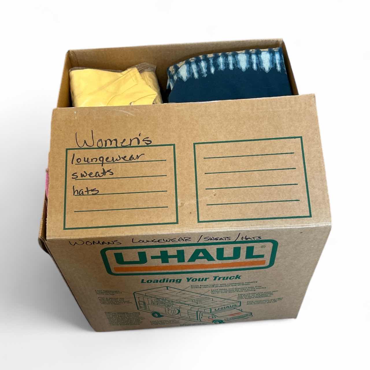 Photo 1 of BOX OF WOMENS LOUNGEWEAR, SWEATS AND HATS SOME NEW WITH TAGS (ASSORTED SIZES)