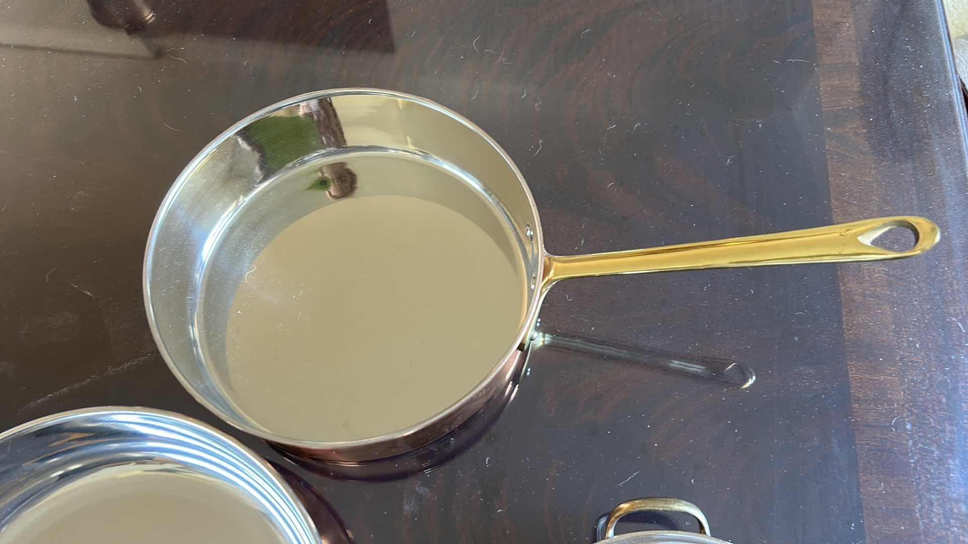 Photo 1 of 3 COPPER AND STAINLESS STEEL  SKILLETS AND PAN WITH BRASS HANDLES