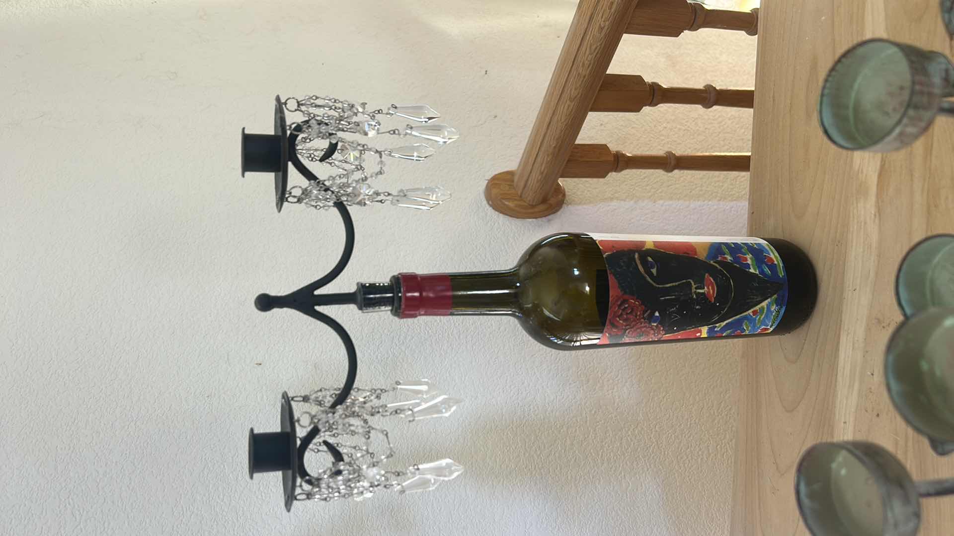 Photo 1 of METAL CANDLE HOLDER  23 1/2“ x H 7“AND WINE BOTTLE WITH CANDLE HOLDER