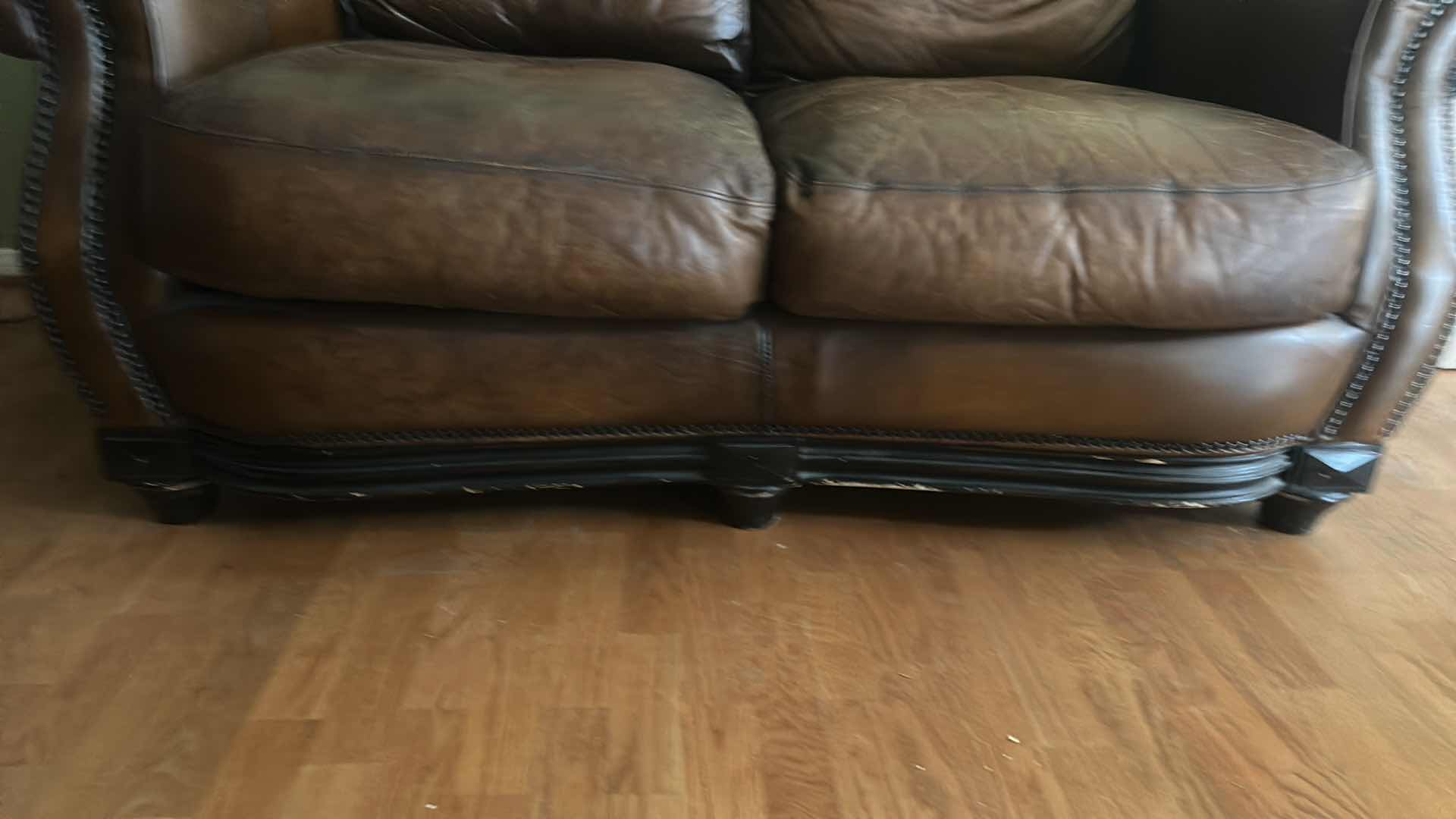 Photo 1 of BROWN LEATHER LOVESEAT WITH NAIL HEAD TRIM AND WOOD BASE & LEGS  69“ x 39“ x H36“