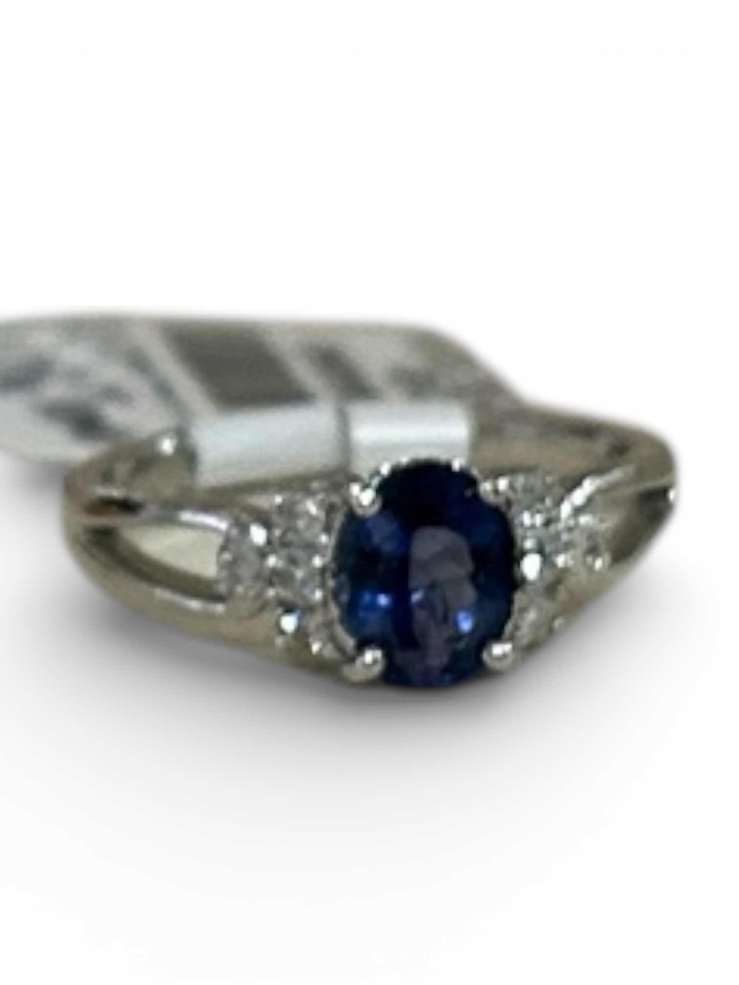Photo 1 of STERLING SILVER W NATURAL TANZANITE (HEATED) APPROX 1.06 CT OVAL FACETED AND NATURAL DIAMOND 0.15 CTW RING GGA CERTIFIED (EST SIZE 7.5)- RN040648