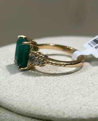 Photo 1 of 925 STERLING SILVER W 18K GOLD OVERLAY EMERALD & DIAMOND RING
EMERALD APPROX 3.95 CTW AND DIAMONDS APPROX 0.32 CTW
GGA CERTIFIED, EST SIZE 7.5  -RN040653