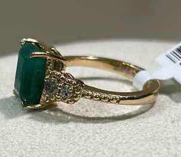 Photo 1 of 925 STERLING SILVER W 18K GOLD OVERLAY EMERALD & DIAMOND RING
EMERALD APPROX 3.95 CTW AND DIAMONDS APPROX 0.32 CTW
GGA CERTIFIED, EST SIZE 7.5  -RN040653