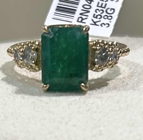 Photo 1 of 925 STERLING SILVER W 18K GOLD OVERLAY EMERALD & DIAMOND RING
EMERALD APPROX 3.95 CTW AND DIAMONDS APPROX 0.32 CTW
GGA CERTIFIED, EST SIZE 7.5  -RN040653