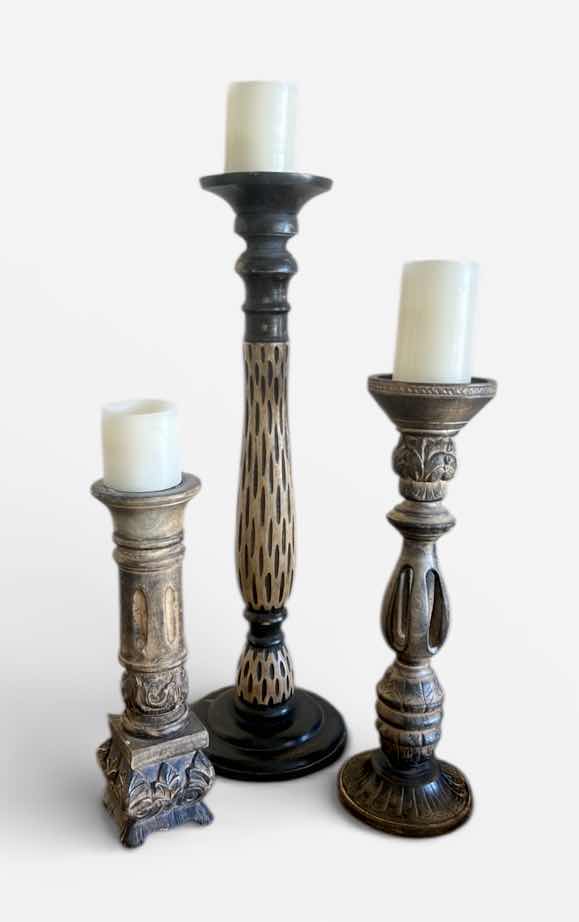 Photo 1 of SET OF THREE DECORATIVE CANDLE HOLDERS IN VARIED HEIGHTS. CARVED WOOD  WITH A DISTRESSED FINISH. (TALLEST H25 1/2”)