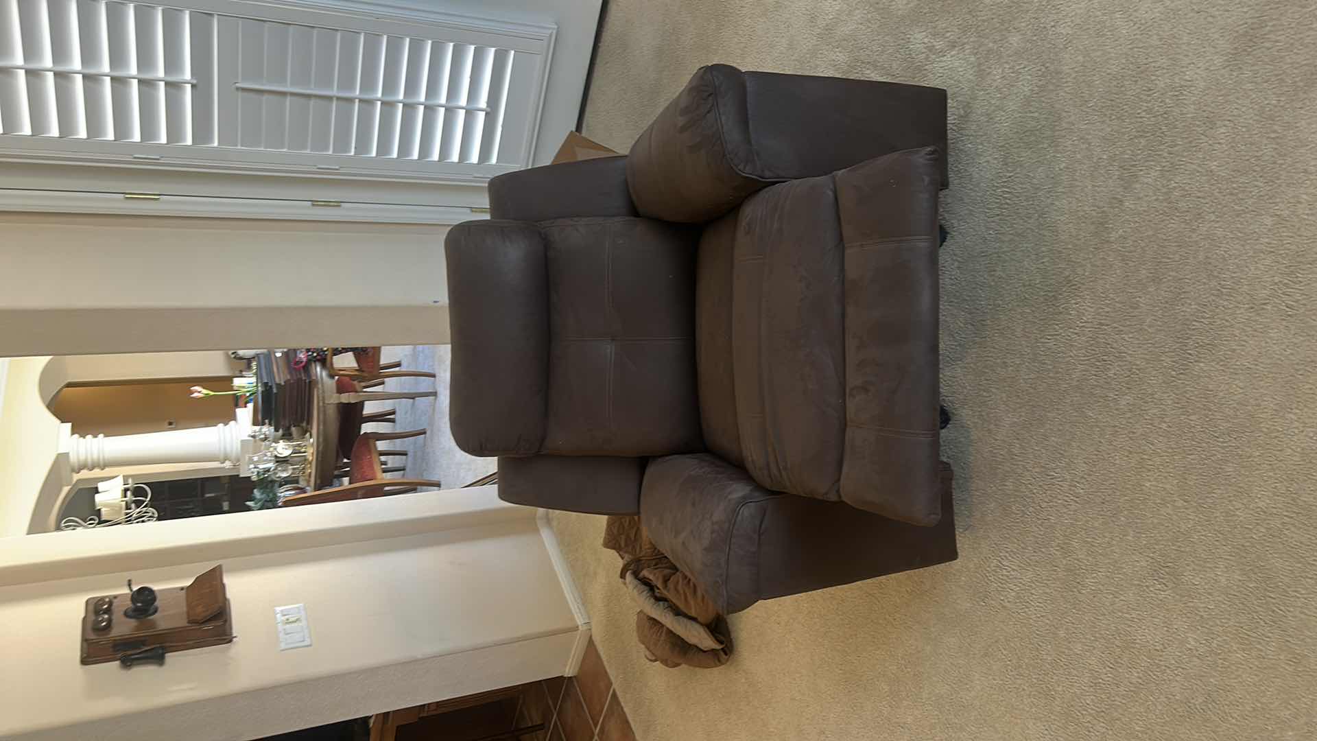 Photo 1 of ASHLEY FURNITURE ROCKER RECLINER WITH LEATHER-LOOK UPHOLSTERY. MADE OF POLYURETHANE, POLYESTER, AND FIBER MATERIALS.