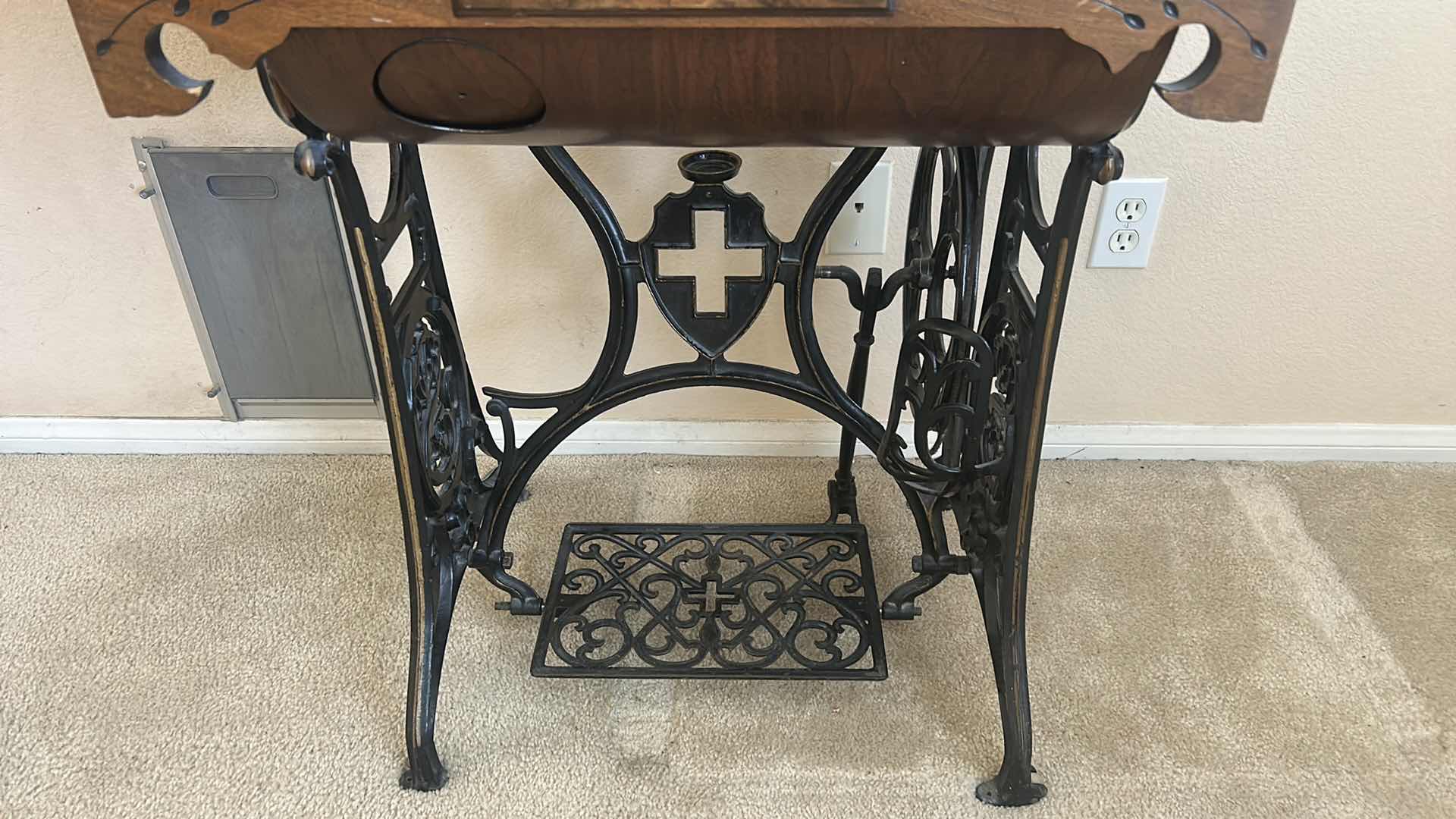 Photo 1 of ANTIQUE HELVETIA TREADLE SEWING MACHINE AND CABINET, ORNATE CAST IRON AND GOLD DETAILING PLUS PARTS. INCLUDES CAST IRON TREADLE BASE, SEWING MACHINE HEAD, WOOD TABLE TOP, DRAWERS, AND LOOSE WOOD COMPONENTS. 
36 1/2“ x 18 1/2“ x H32“
