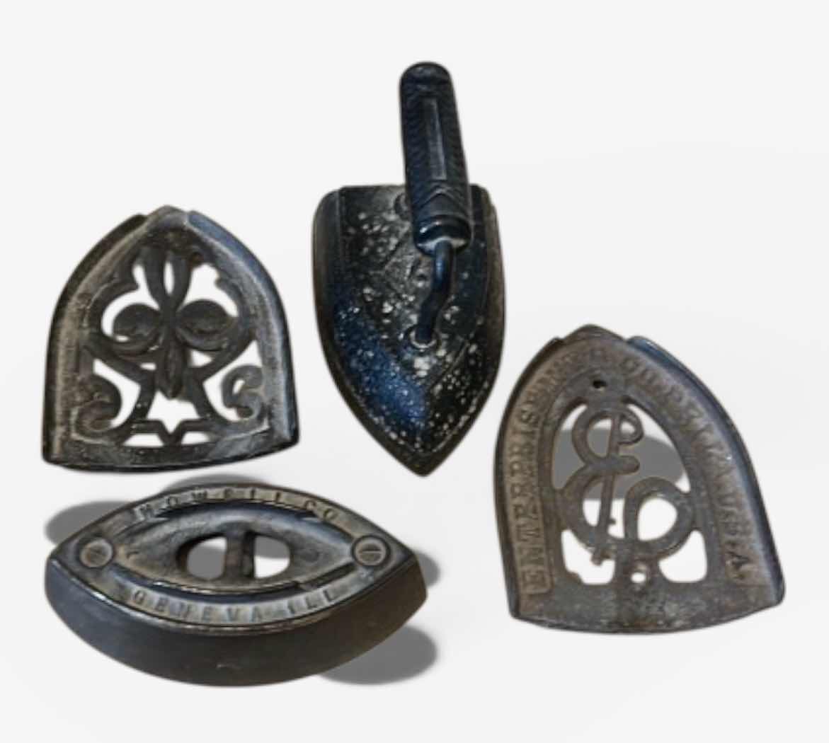 Photo 1 of ANTIQUE CAST IRON IRONS AND IRON TRIVETS. INCLUDES SAD IRONS AND DECORATIVE IRON RESTS