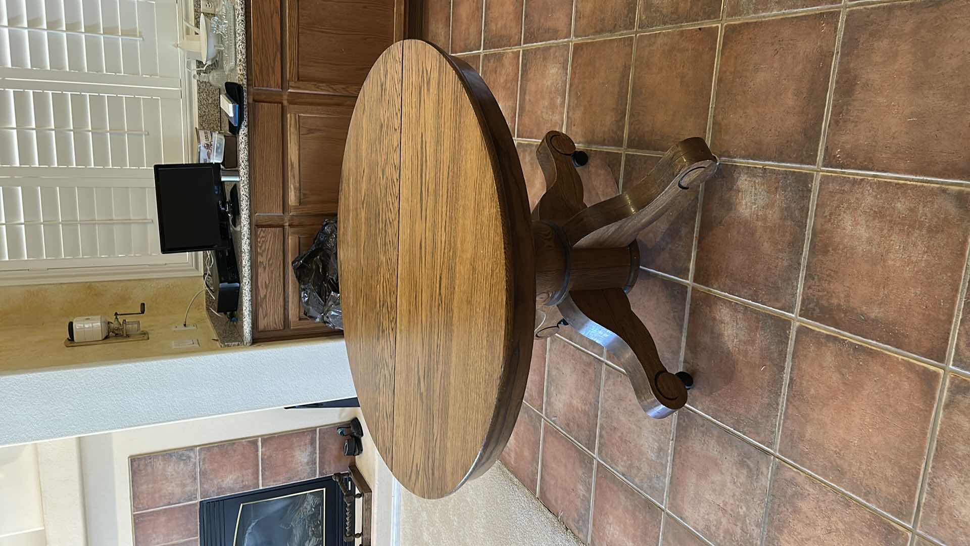 Photo 1 of ANTIQUE OAK ROUND PEDESTAL DINING TABLE  ON CASTERS. 43 1/2“ x H30 1/2“ PLUS 3 9.5” LEAFS