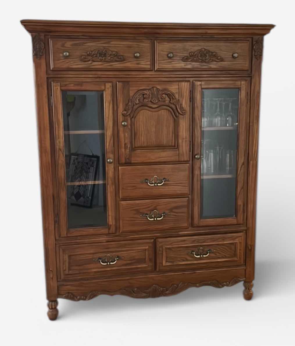 Photo 1 of TRADITIONAL CARVED WOOD HUTCH OR ARMOIRE, OFTEN REFERRED TO AS A CHINA CABINET. FEATURES DARK CHERRY OR WALNUT FINISH WITH GLASS-PANELED DOORS AND DRAWERS FOR STORAGE. 54 1/2” x 19” x H65” TONGUE AND GROOVE