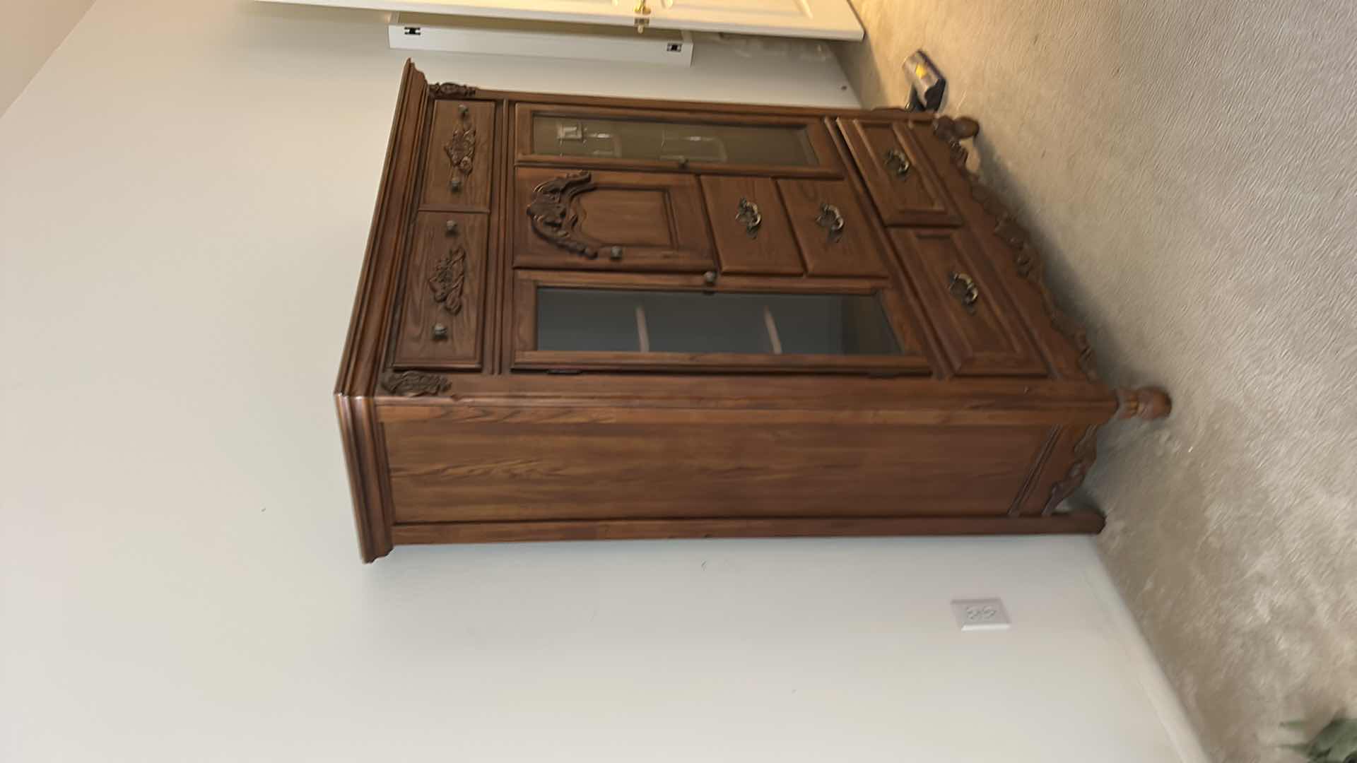 Photo 1 of TRADITIONAL CARVED WOOD HUTCH OR ARMOIRE, OFTEN REFERRED TO AS A CHINA CABINET. FEATURES DARK CHERRY OR WALNUT FINISH WITH GLASS-PANELED DOORS AND DRAWERS FOR STORAGE. 54 1/2” x 19” x H65” TONGUE AND GROOVE