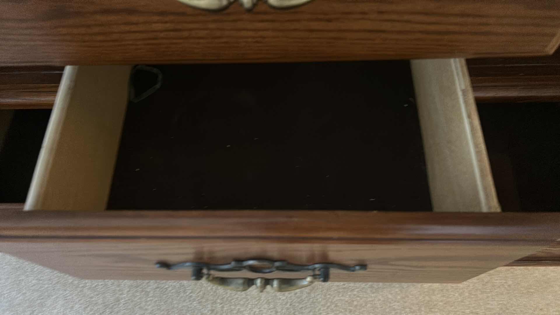 Photo 1 of TRADITIONAL CARVED WOOD HUTCH OR ARMOIRE, OFTEN REFERRED TO AS A CHINA CABINET. FEATURES DARK CHERRY OR WALNUT FINISH WITH GLASS-PANELED DOORS AND DRAWERS FOR STORAGE. 54 1/2” x 19” x H65” TONGUE AND GROOVE