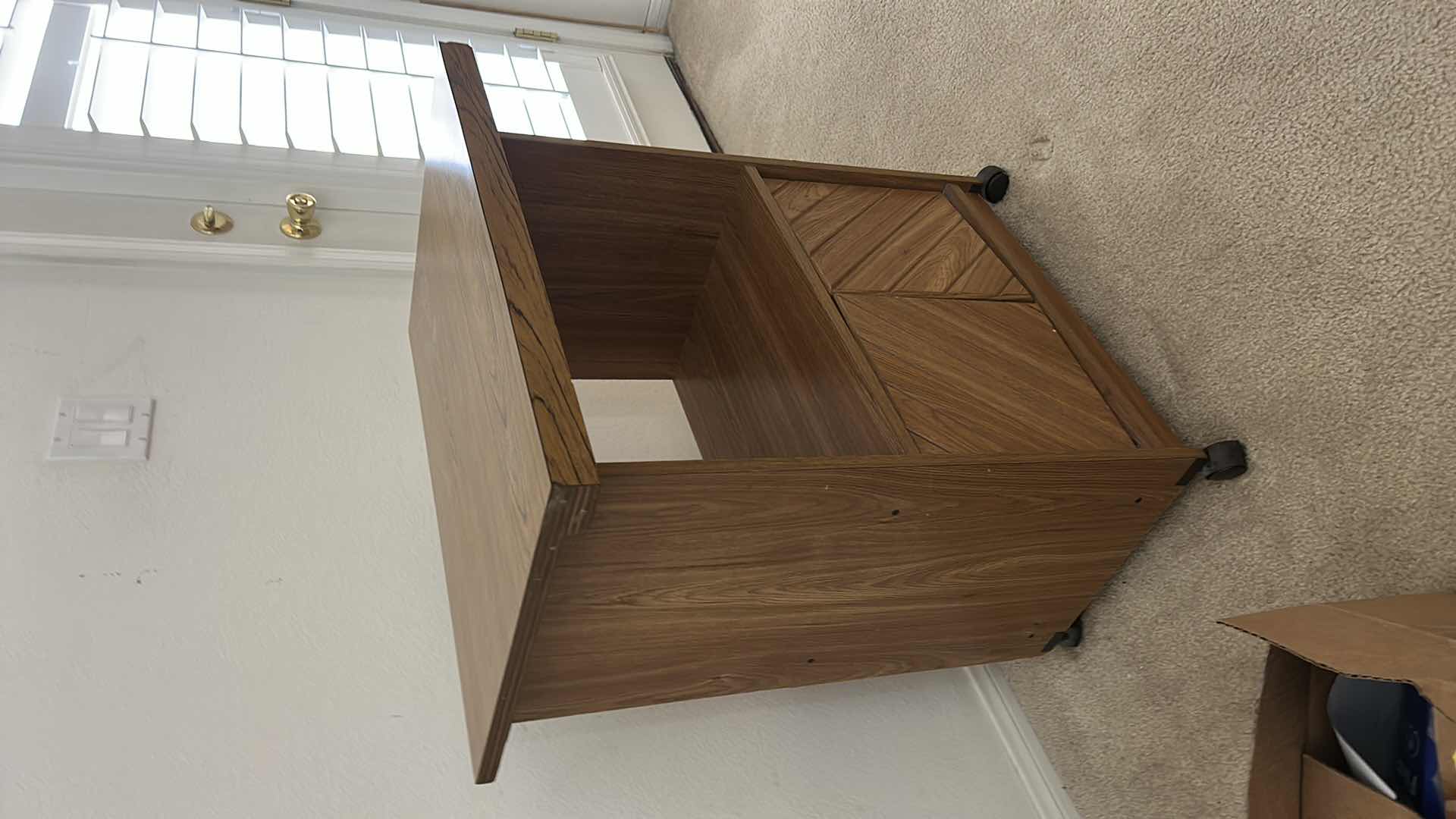 Photo 1 of MID-CENTURY MODERN-STYLE WOOD SIDE TABLE WITH A CABINET AND CASTERS. 27“ x 17“ x H30 1/2“