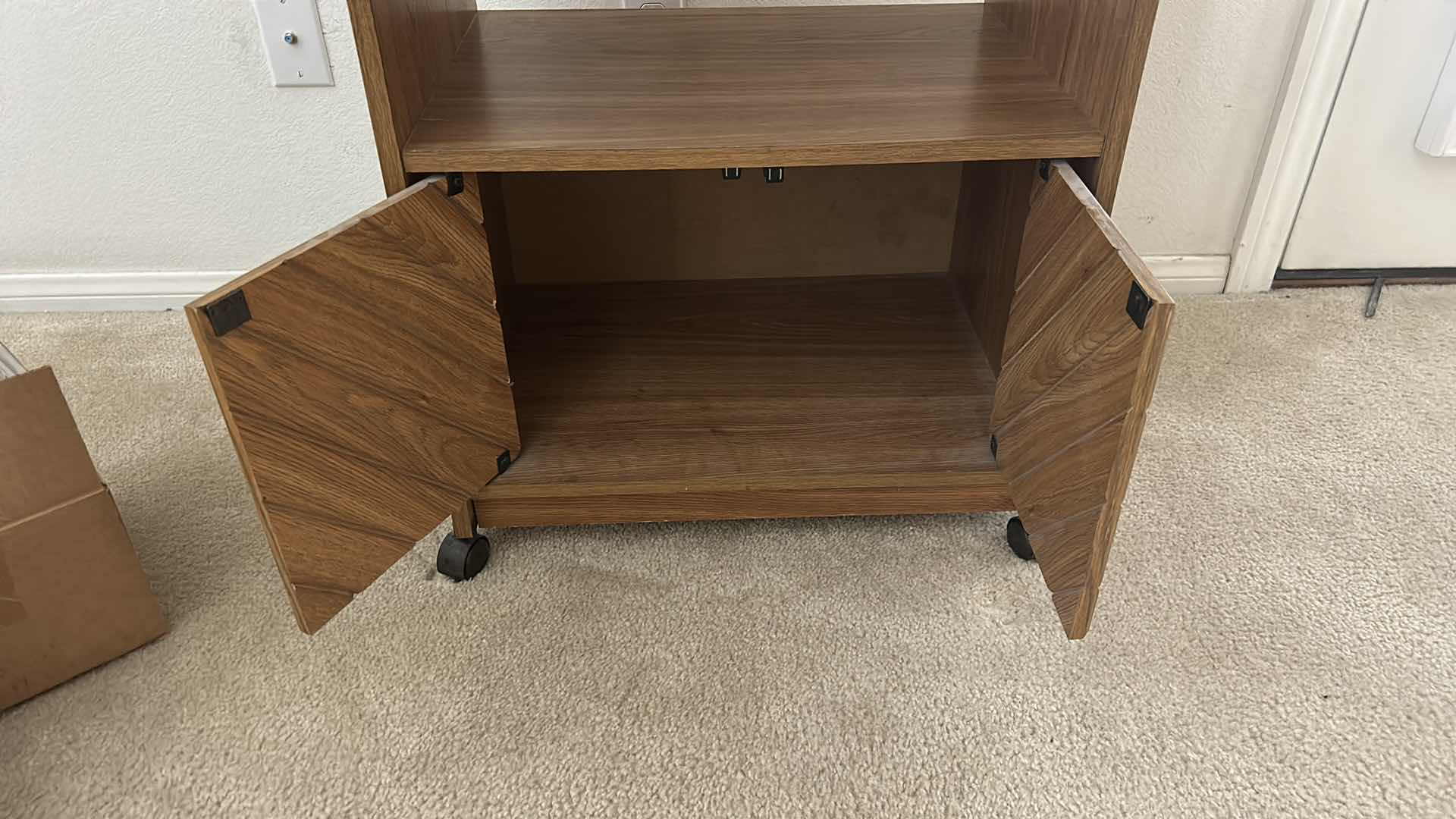 Photo 1 of MID-CENTURY MODERN-STYLE WOOD SIDE TABLE WITH A CABINET AND CASTERS. 27“ x 17“ x H30 1/2“