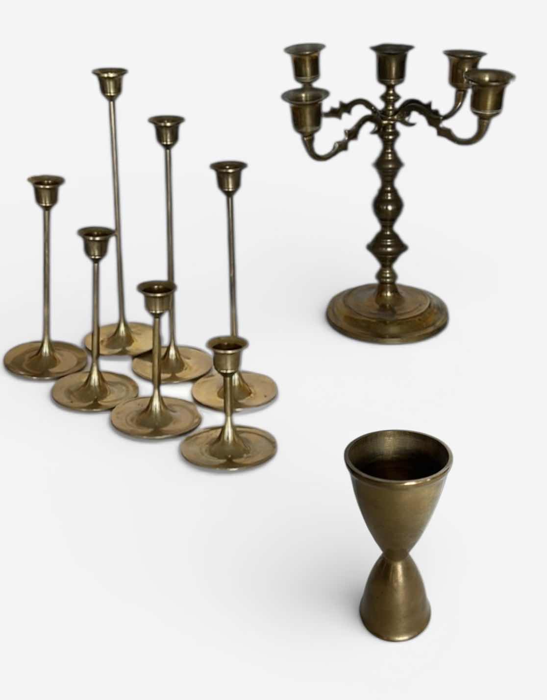 Photo 1 of BRASS CANDLE HOLDERS AND CANDLE ACCESSORIES. INCLUDES MULTIPLE TALL TAPER HOLDERS, A MULTI-ARM CANDELABRA H10” AND A BRASS CUP.