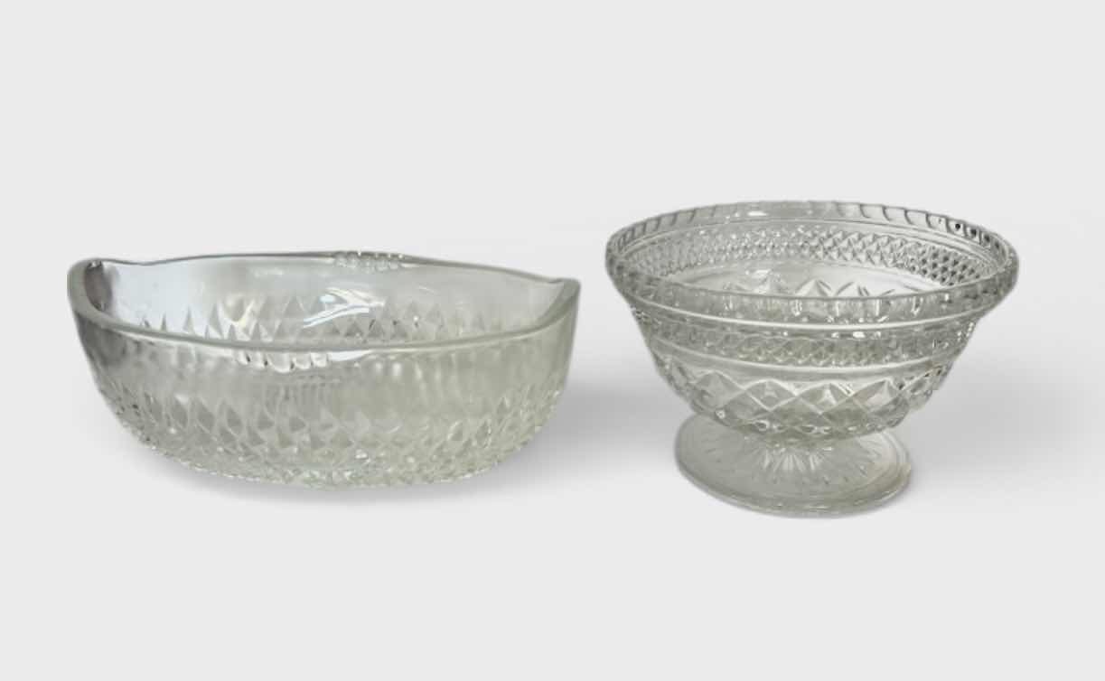 Photo 1 of SET OF TWO CLEAR PRESSED GLASS BOWLS. ONE OVAL SERVING BOWL AND ONE PEDESTAL BOWL H4.25”WITH CUT PATTERN DESIGN.