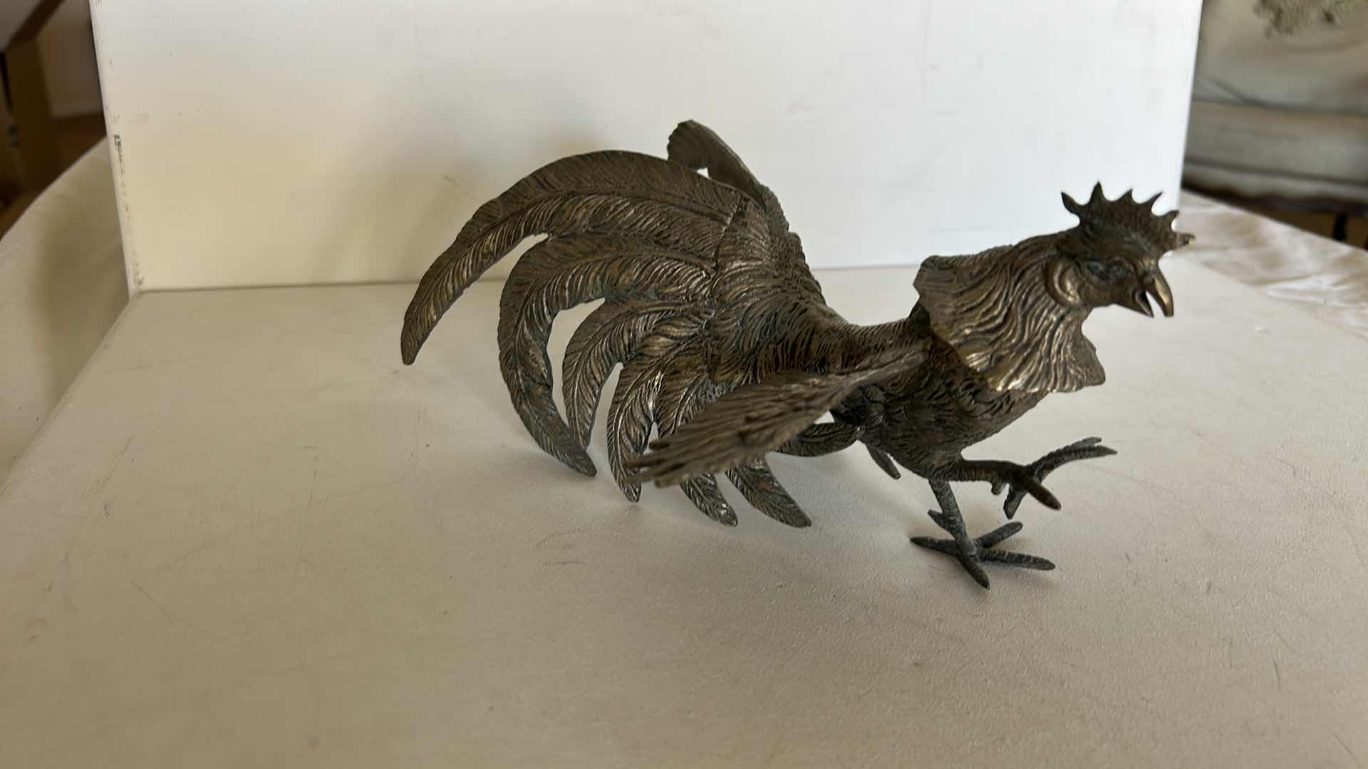 Photo 1 of DECORATIVE METAL ROOSTER FIGURINE WITH DETAILED FEATHER DESIGN. 9” x H4 1/2”